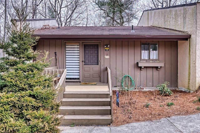 doorway to property with board and batten siding