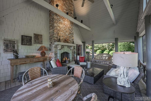 view of patio featuring an outdoor living space with a fireplace and ceiling fan