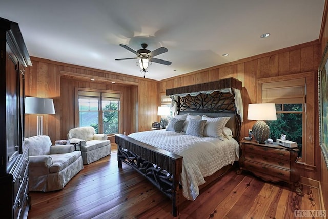 bedroom with dark hardwood / wood-style floors and ceiling fan