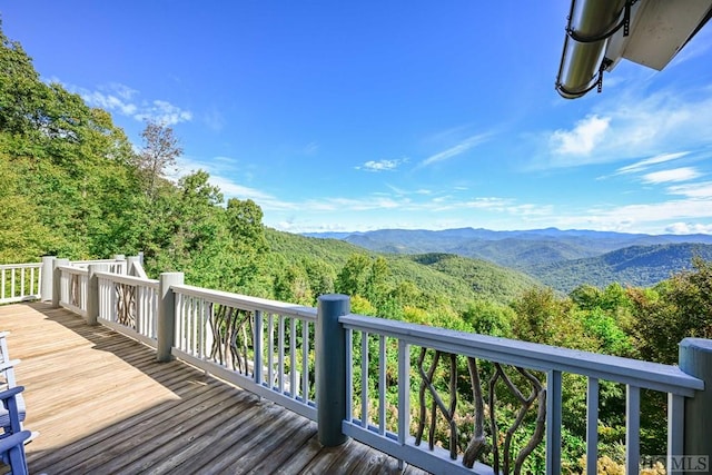 wooden deck featuring a mountain view