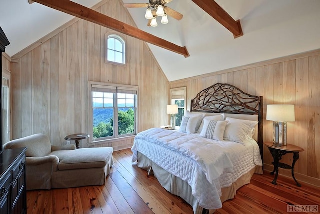 bedroom with beam ceiling, wood-type flooring, high vaulted ceiling, and ceiling fan