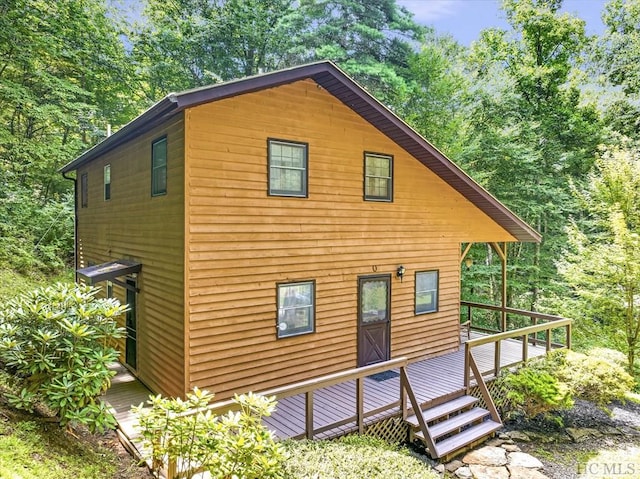 view of property exterior featuring a deck