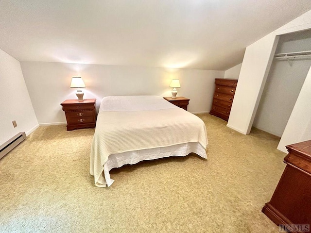 carpeted bedroom with a baseboard radiator, a closet, and vaulted ceiling