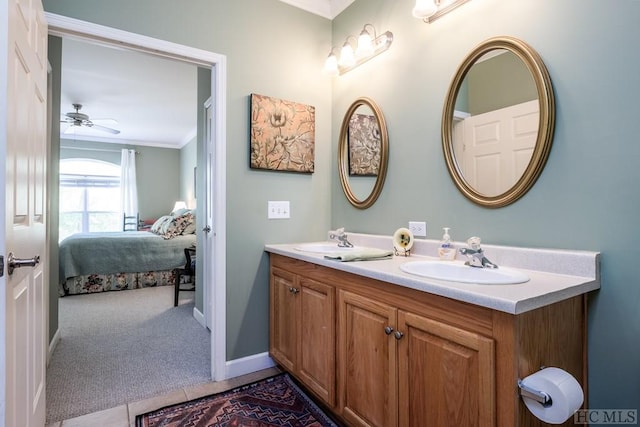 bathroom with ceiling fan, tile patterned floors, vanity, and crown molding