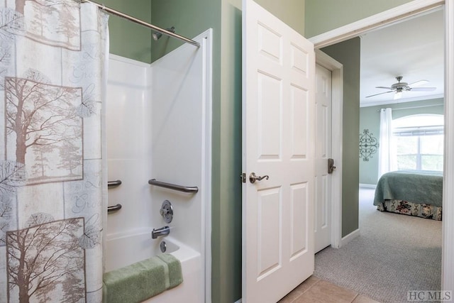 bathroom with ceiling fan, tile patterned flooring, and shower / tub combo with curtain