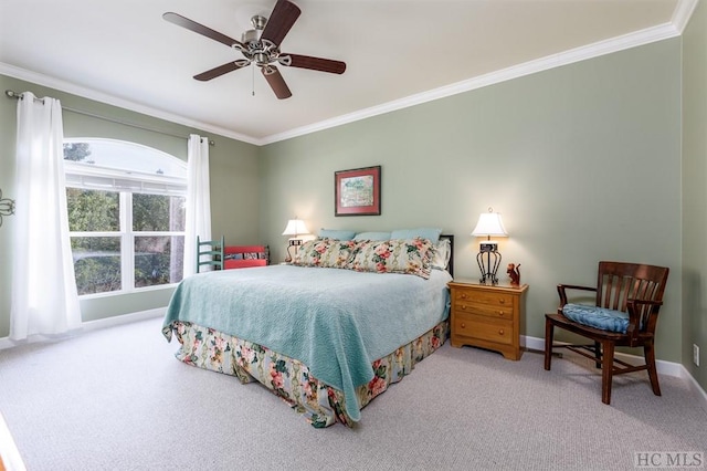 carpeted bedroom with ceiling fan and crown molding