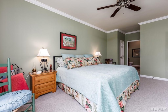 carpeted bedroom featuring ceiling fan, ensuite bathroom, and crown molding