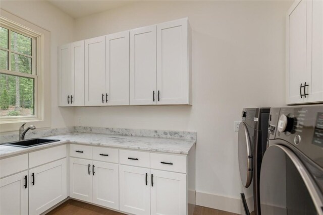 343 Ledgeview Rd, Cashiers, NC 28717 - laundry area featuring cabinet space, washing machine and clothes dryer, and dark wood-style floors