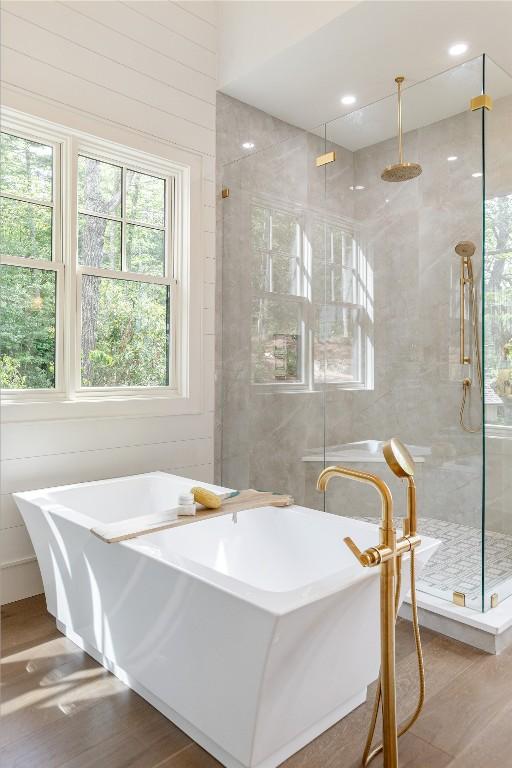 343 Ledgeview Rd, Cashiers, NC 28717 - bathroom featuring a freestanding bath, a shower stall, and wood finished floors