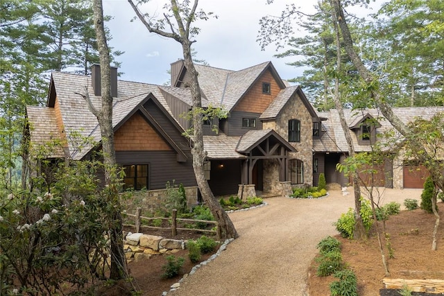343 Ledgeview Rd, Cashiers, NC 28717 - view of front of house with stone siding, a chimney, and dirt driveway