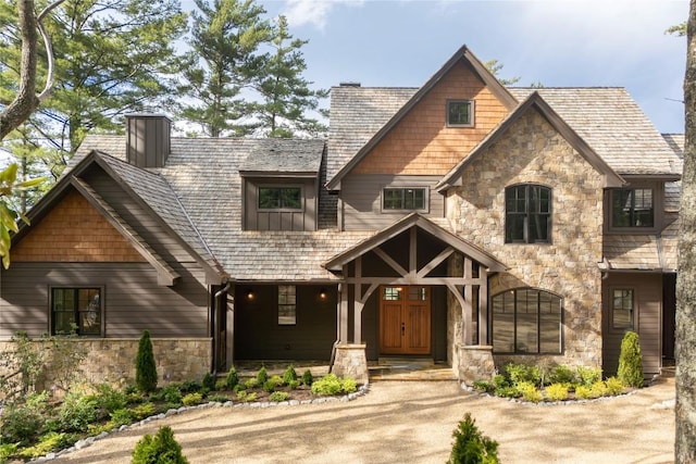 343 Ledgeview Rd, Cashiers, NC 28717 - view of front of home with stone siding, a chimney, and a porch
