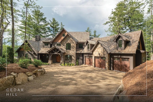 343 Ledgeview Rd, Cashiers, NC 28717 - view of front of house with stone siding, concrete driveway, and an attached garage