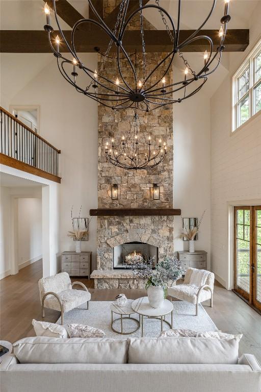 343 Ledgeview Rd, Cashiers, NC 28717 - living area featuring a high ceiling, a chandelier, plenty of natural light, and wood finished floors