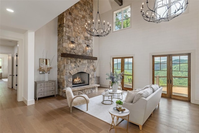 343 Ledgeview Rd, Cashiers, NC 28717 - living room with a chandelier, wood finished floors, plenty of natural light, french doors, and high vaulted ceiling
