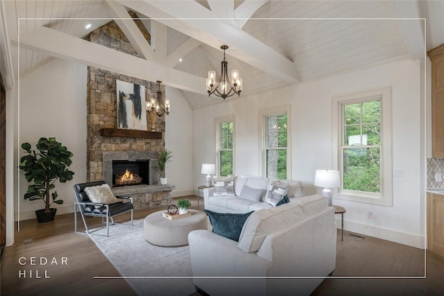 343 Ledgeview Rd, Cashiers, NC 28717 - living area featuring plenty of natural light, a fireplace, a chandelier, and wood finished floors