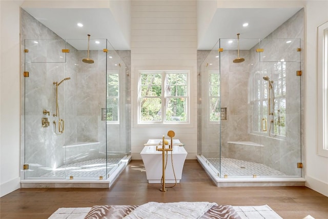 343 Ledgeview Rd, Cashiers, NC 28717 - bathroom with wood finished floors, a soaking tub, and a shower stall