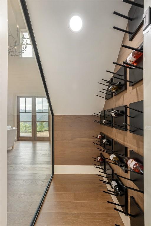 343 Ledgeview Rd, Cashiers, NC 28717 - wine room with wood finished floors and a chandelier