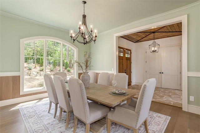 343 Ledgeview Rd, Cashiers, NC 28717 - dining space with a chandelier, a wooden ceiling with exposed beams, wood finished floors, and ornamental molding