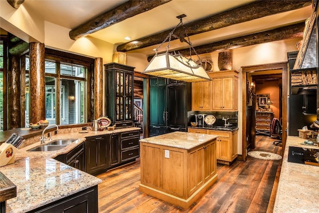 1090 Zeb Alley Rd, Cashiers, NC 28717 - kitchen featuring beam ceiling, dark wood finished floors, light stone countertops, a center island, and paneled built in refrigerator