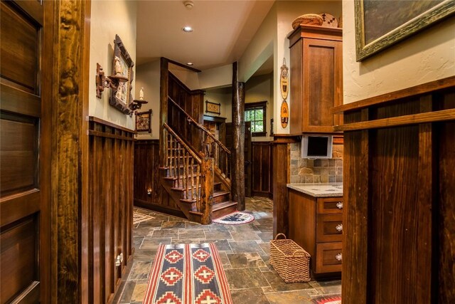 1090 Zeb Alley Rd, Cashiers, NC 28717 - wine cellar featuring dark stone finish floors, wainscoting, recessed lighting, and wooden walls