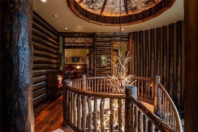 1090 Zeb Alley Rd, Cashiers, NC 28717 - stairs with rustic walls, wood finished floors, recessed lighting, and a tray ceiling