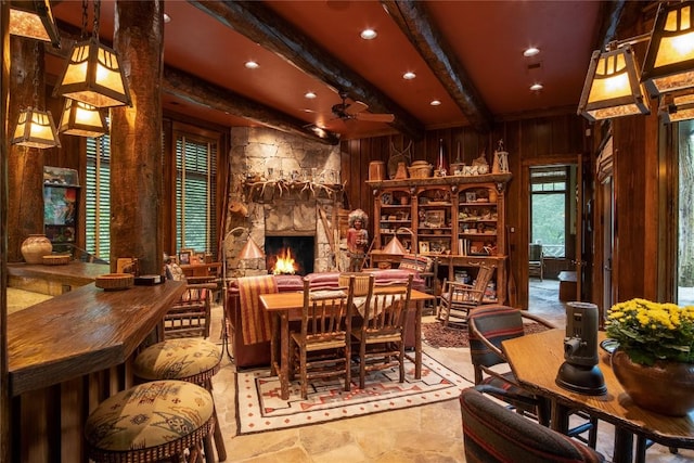 1090 Zeb Alley Rd, Cashiers, NC 28717 - dining room with beamed ceiling, wooden walls, a stone fireplace, and recessed lighting