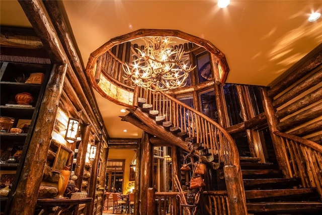 1090 Zeb Alley Rd, Cashiers, NC 28717 - stairs featuring a high ceiling and a chandelier