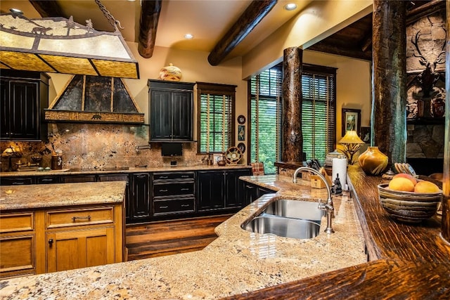 1090 Zeb Alley Rd, Cashiers, NC 28717 - kitchen featuring ventilation hood, beamed ceiling, decorative backsplash, light stone countertops, and dark cabinets