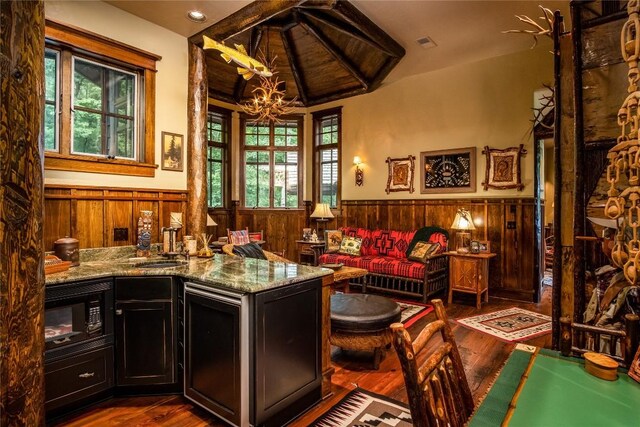 1090 Zeb Alley Rd, Cashiers, NC 28717 - sitting room featuring a wainscoted wall, wood walls, wood finished floors, a chandelier, and vaulted ceiling