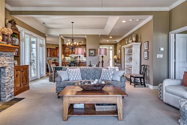 living room featuring light colored carpet, baseboards, an inviting chandelier, and ornamental molding