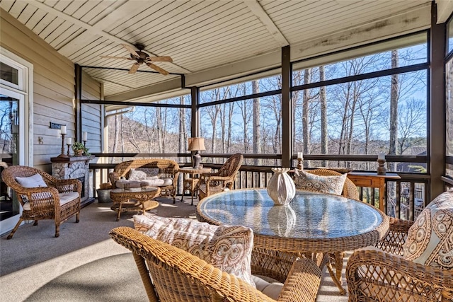 sunroom with a ceiling fan