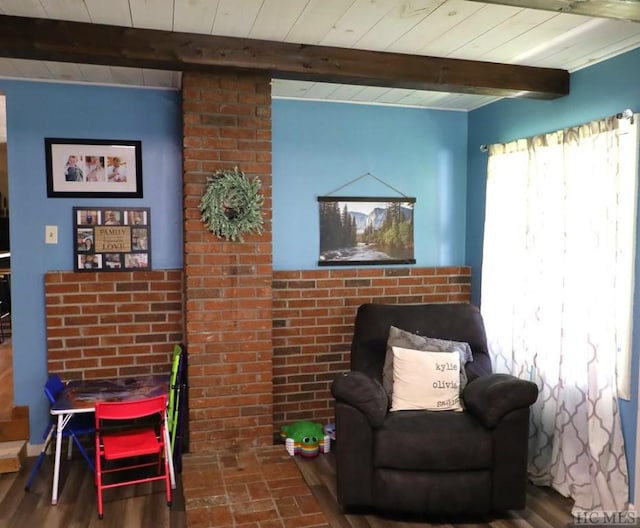 living area featuring wood ceiling, hardwood / wood-style floors, and beam ceiling