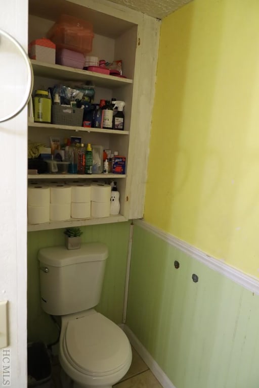 bathroom featuring tile patterned floors and toilet