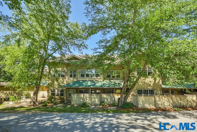 view of front of house with fence