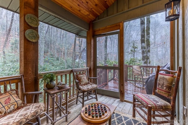 sunroom / solarium with lofted ceiling and wooden ceiling