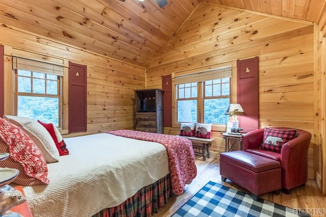 bedroom with wood ceiling, hardwood / wood-style flooring, and wood walls