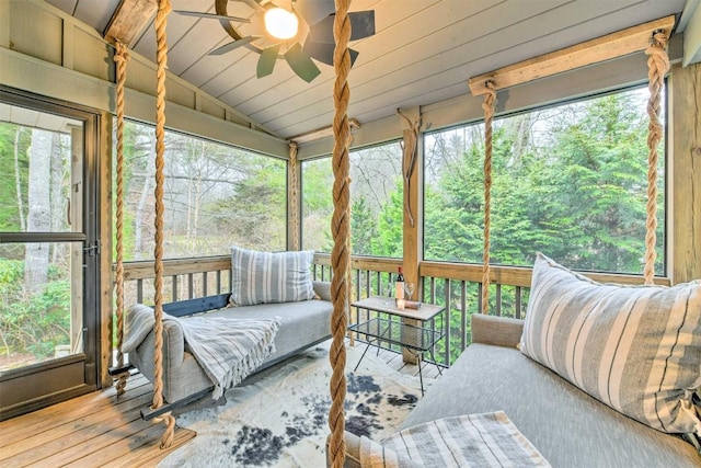 sunroom featuring ceiling fan