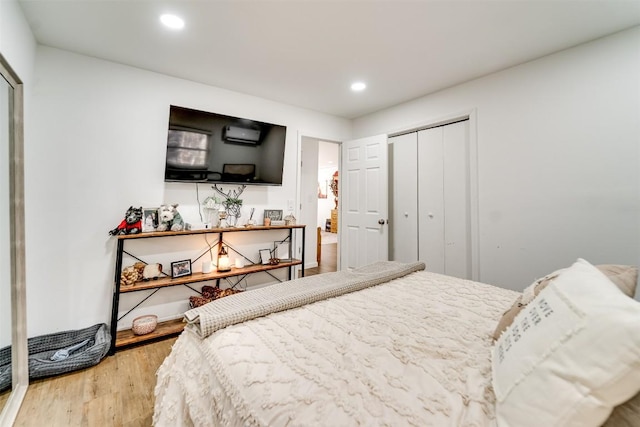 bedroom featuring a closet and light wood-type flooring