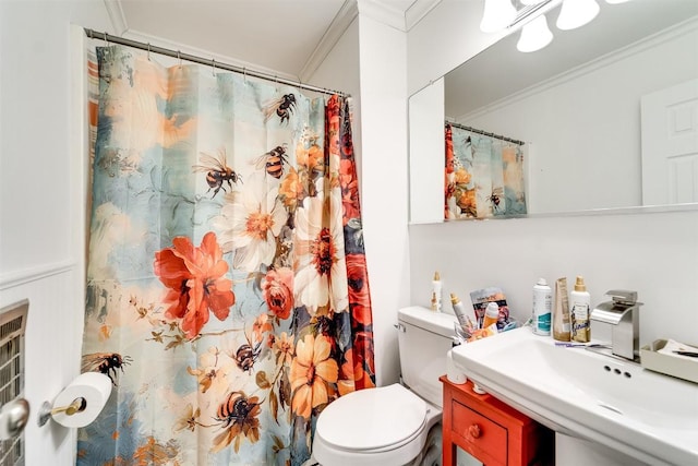 bathroom featuring sink, crown molding, toilet, and a shower with shower curtain