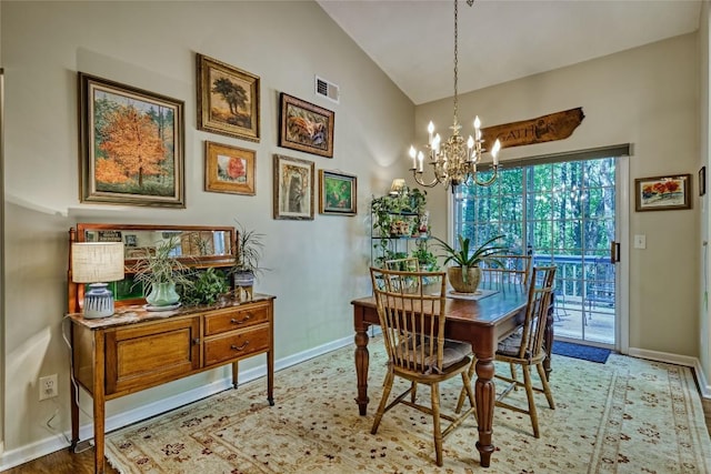 236 Hemlock Woods Dr, Highlands, NC 28741 - dining area featuring a chandelier and high vaulted ceiling