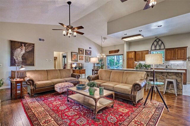 236 Hemlock Woods Dr, Highlands, NC 28741 - living area featuring a ceiling fan, dark wood-type flooring, high vaulted ceiling, and a chandelier