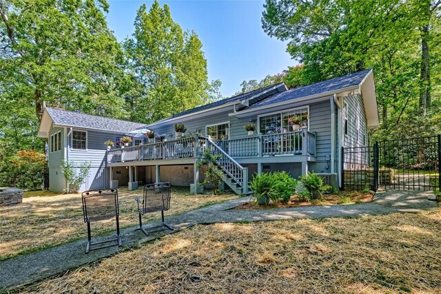 236 Hemlock Woods Dr, Highlands, NC 28741 - back of house featuring stairs, a wooden deck, a gate, and a shingled roof