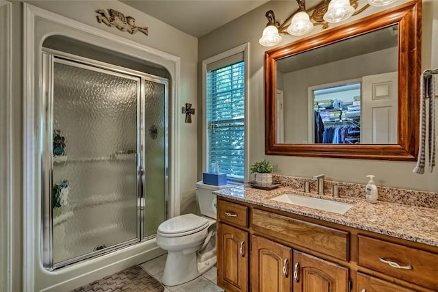 236 Hemlock Woods Dr, Highlands, NC 28741 - full bath featuring vanity, a shower stall, tile patterned flooring, and a walk in closet