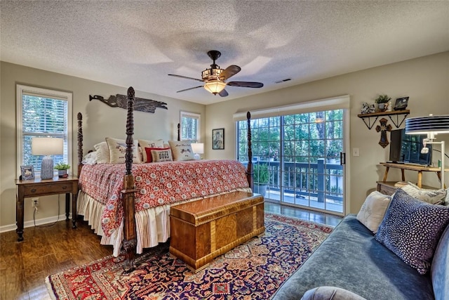 236 Hemlock Woods Dr, Highlands, NC 28741 - bedroom featuring access to outside, wood finished floors, a textured ceiling, and ceiling fan