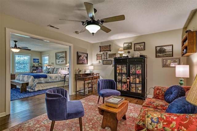 236 Hemlock Woods Dr, Highlands, NC 28741 - living area featuring ceiling fan, wood finished floors, and a textured ceiling