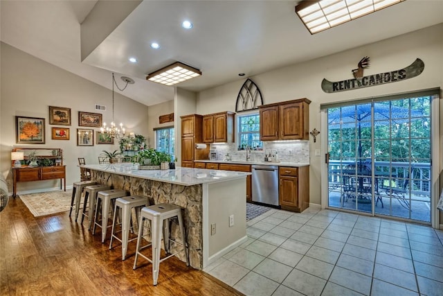 236 Hemlock Woods Dr, Highlands, NC 28741 - kitchen featuring dishwasher, a breakfast bar area, a chandelier, recessed lighting, and a center island