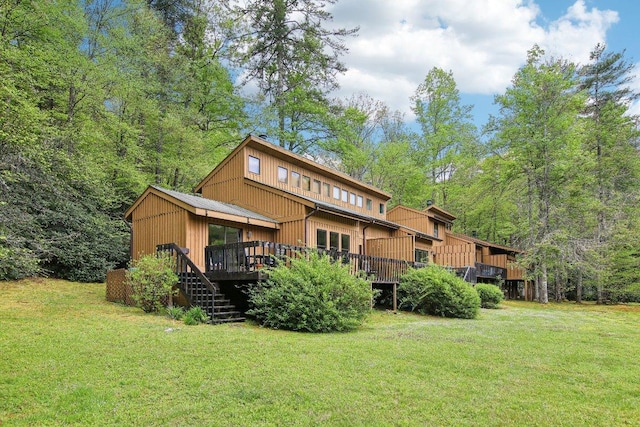 383 Wild Game Trl Unit D, Sapphire, NC 28774 - back of house with a lawn, a wooden deck, and stairway