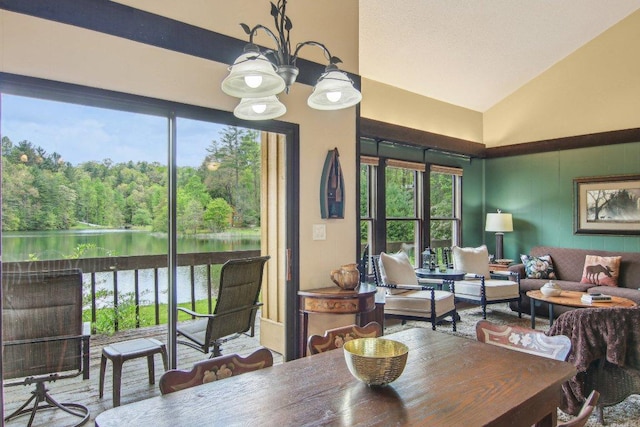 383 Wild Game Trl Unit D, Sapphire, NC 28774 - dining room with lofted ceiling, healthy amount of natural light, a water view, and a chandelier