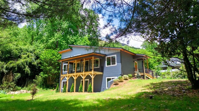back of house with a yard
