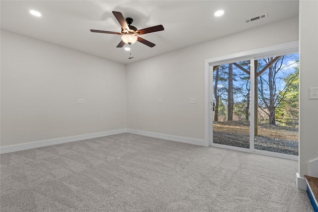 carpeted empty room with ceiling fan, baseboards, and recessed lighting